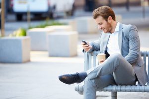 Businessman looking at cellphone